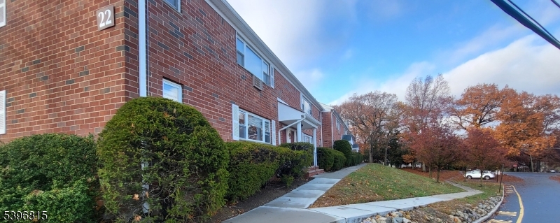 2467 Highway 10, Unit 8B Morris Plains, NJ 07950 - Photo 14 of 15 a view of a house with a yard