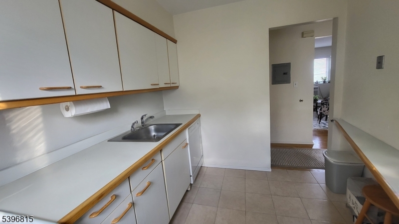 2467 Highway 10, Unit 8B Morris Plains, NJ 07950 - Photo 5 of 15 a kitchen with a sink and cabinets