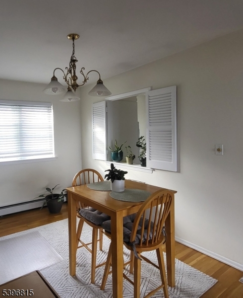 2467 Highway 10, Unit 8B Morris Plains, NJ 07950 - Photo 6 of 15 a view of a dining room with furniture window and wooden floor