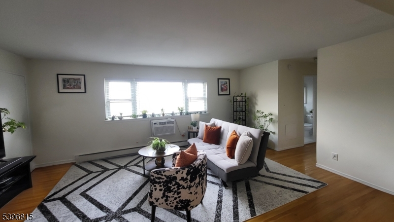 2467 Highway 10, Unit 8B Morris Plains, NJ 07950 - Photo 8 of 15 a living room with furniture and a window
