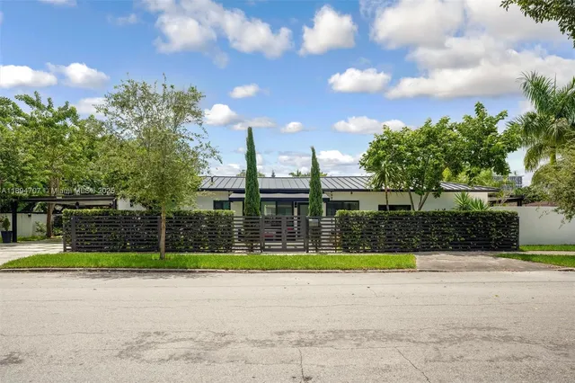 a view of a swimming pool and a yard