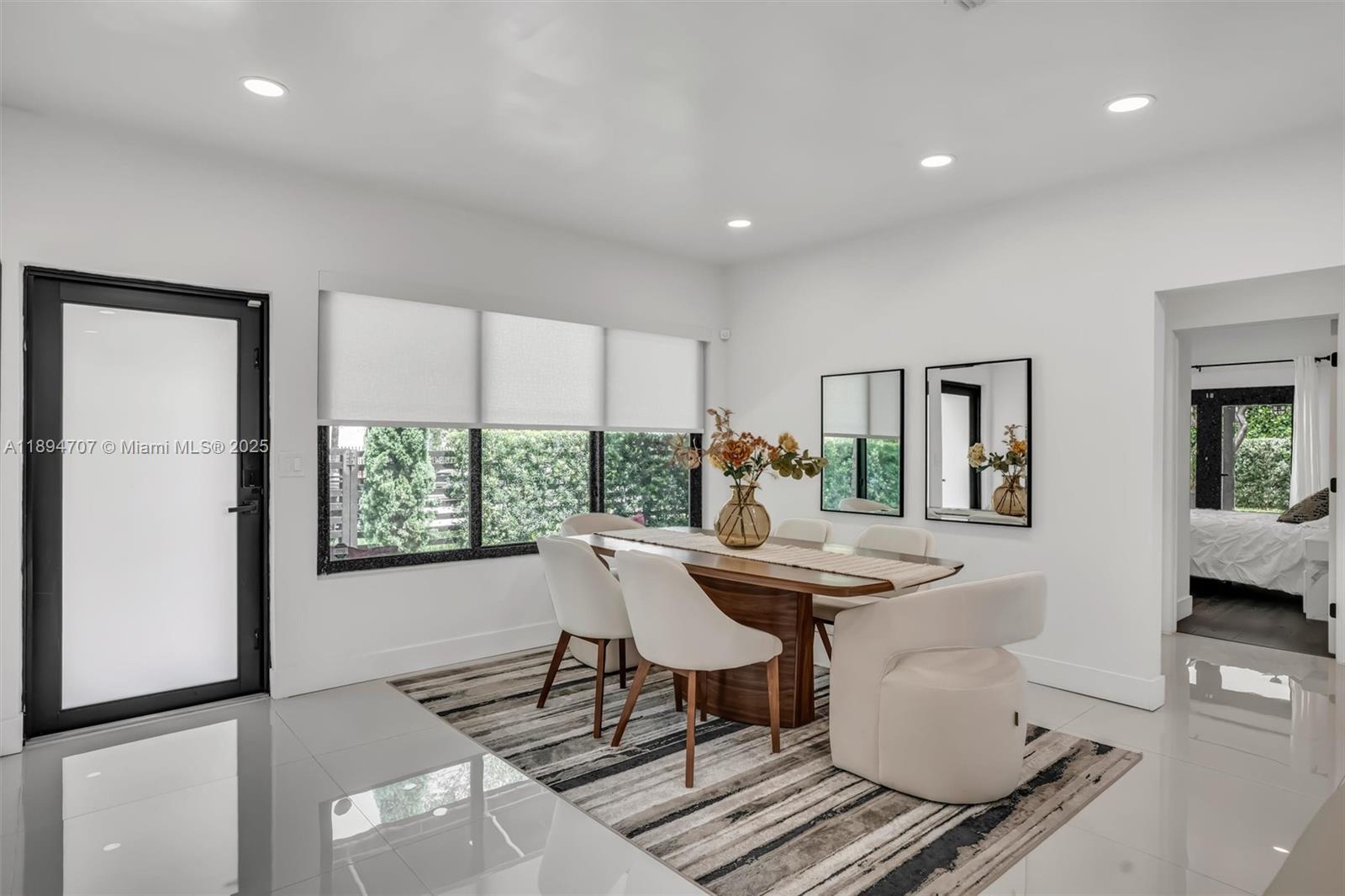 2484 Southwest 25th Street Miami, FL 33133 - Photo 15 of 53 a view of a dining room with furniture window and outside view