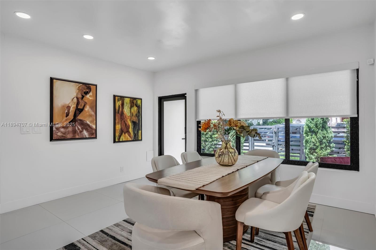 2484 Southwest 25th Street Miami, FL 33133 - Photo 17 of 53 a view of a dining room with furniture window and wooden floor