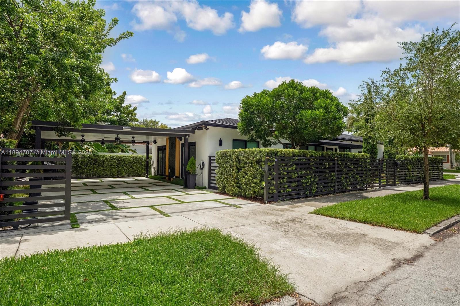 2484 Southwest 25th Street Miami, FL 33133 - Photo 2 of 53 a view of a house with a yard