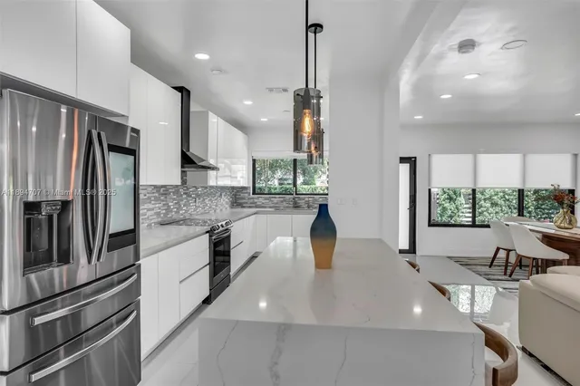 a kitchen with a stove and a white cabinet