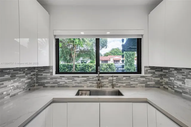 a kitchen with a stove and a sink