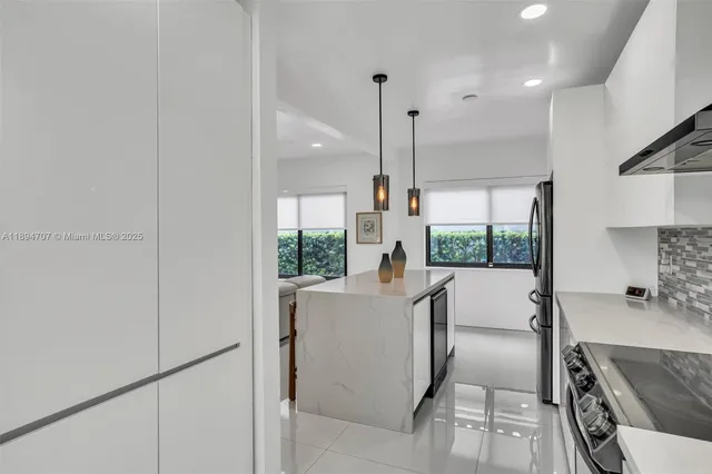 a bathroom with a toilet sink and shower
