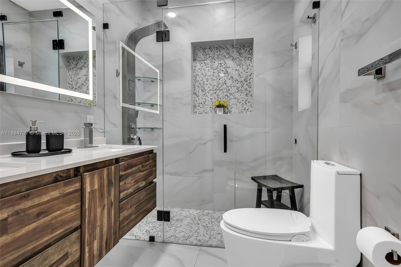 2484 Southwest 25th Street Miami, FL 33133 - Photo 30 of 53 a bathroom with a toilet sink and shower