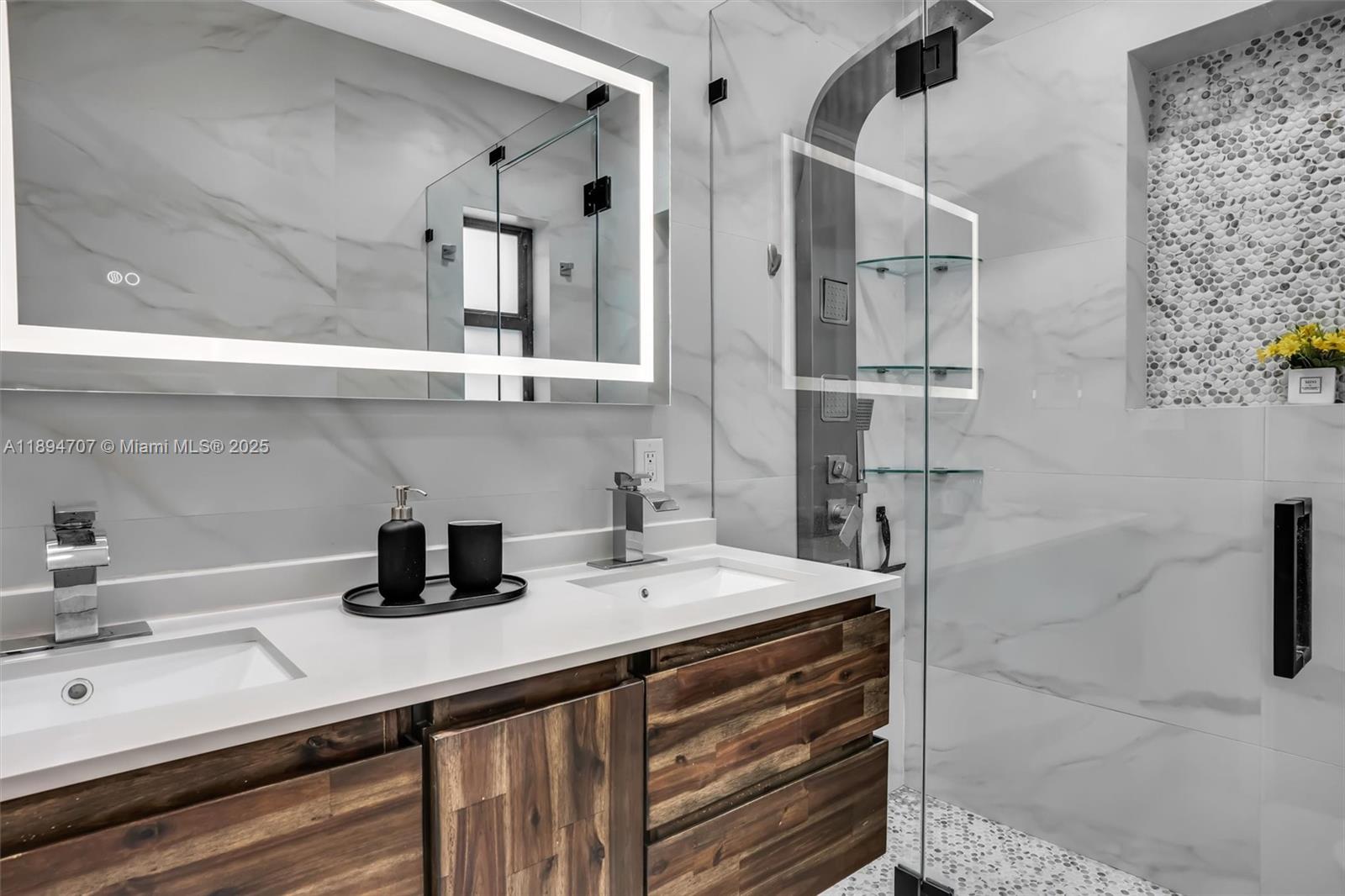 2484 Southwest 25th Street Miami, FL 33133 - Photo 31 of 53 a bathroom with a sink and a mirror