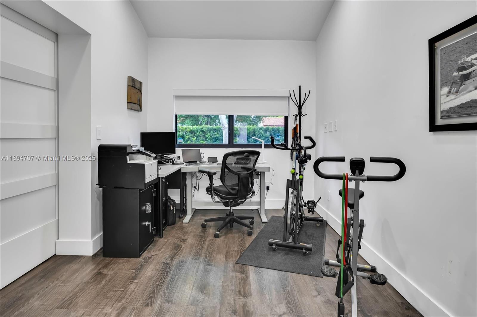 2484 Southwest 25th Street Miami, FL 33133 - Photo 32 of 53 a view of a workspace with furniture and a window