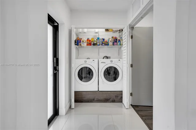 a bedroom with a bed and large window