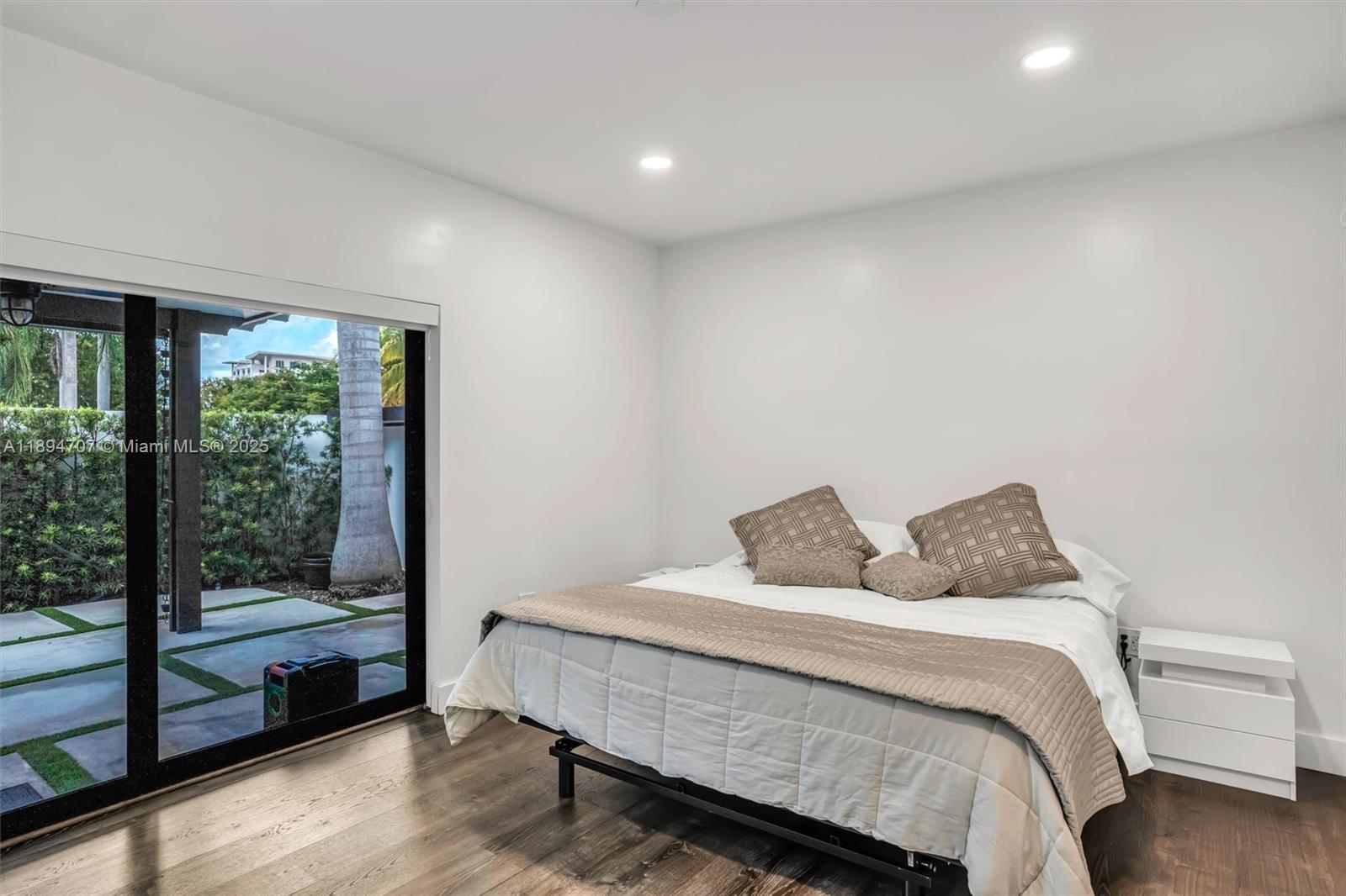 2484 Southwest 25th Street Miami, FL 33133 - Photo 36 of 53 a bedroom with a bed and large window