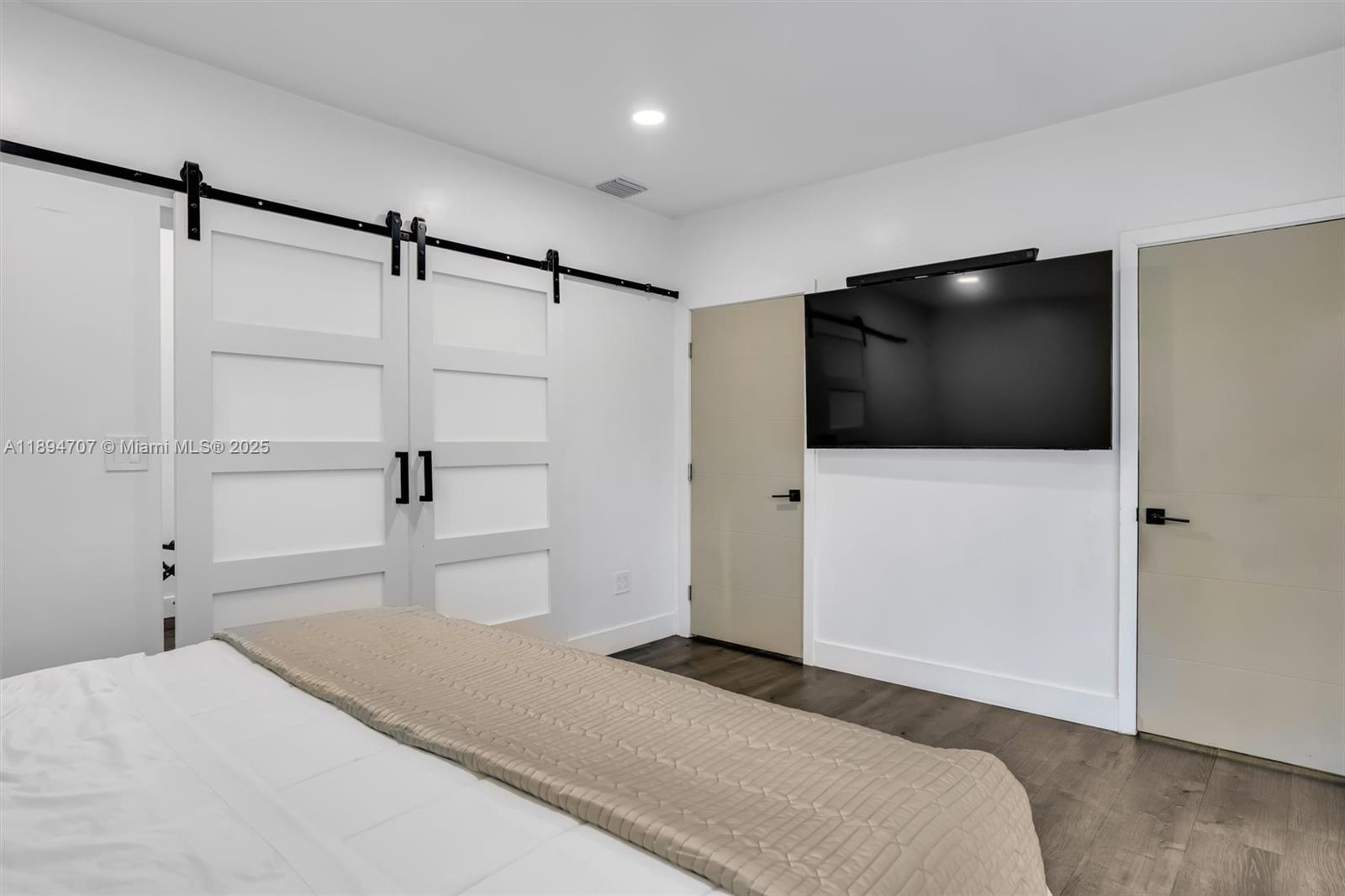 2484 Southwest 25th Street Miami, FL 33133 - Photo 38 of 53 a bedroom with a bed and a flat screen tv