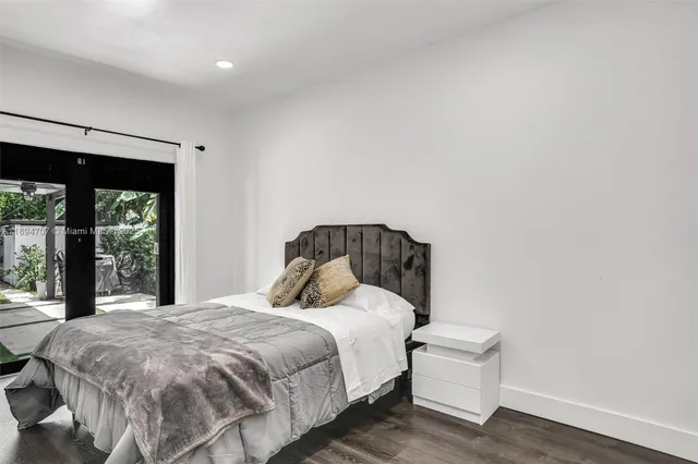 a bedroom with a bed and a cabinets