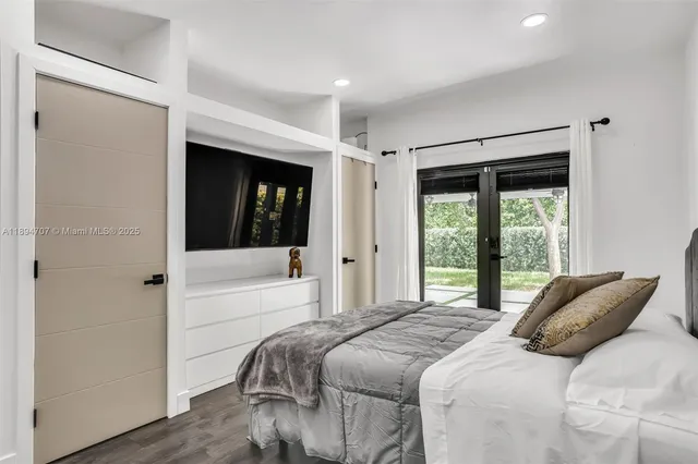 a view of a porch with chairs and backyard