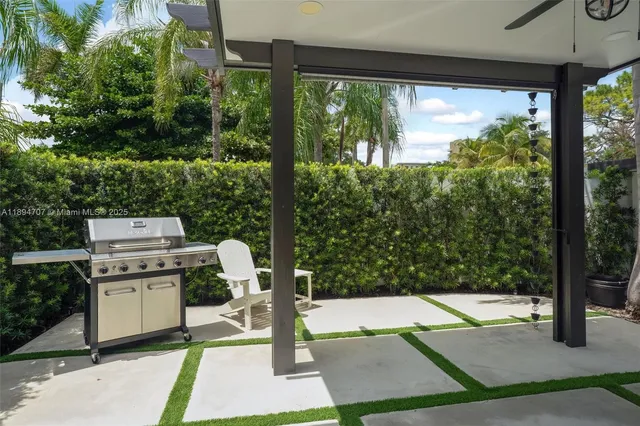 a room with pool table and outdoor seating