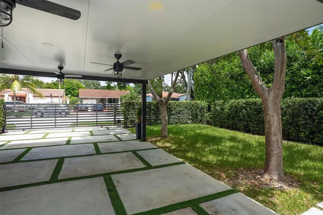 a view of yard with patio