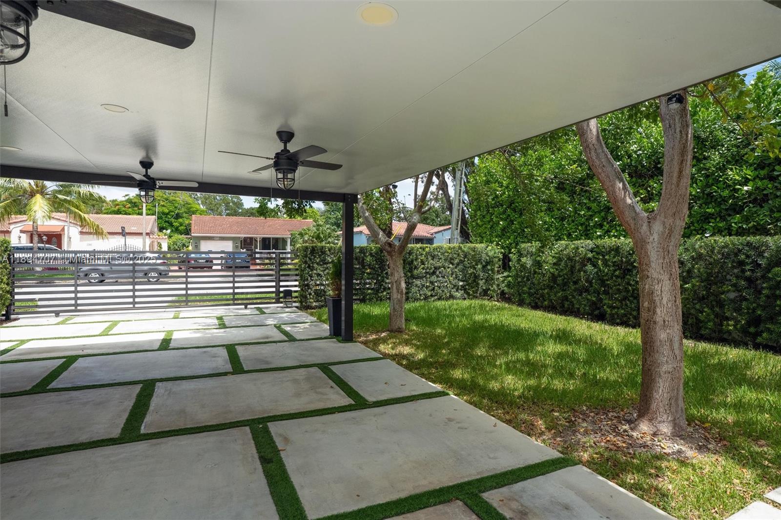 2484 Southwest 25th Street Miami, FL 33133 - Photo 10 of 53 a view of a porch with chairs and a yard