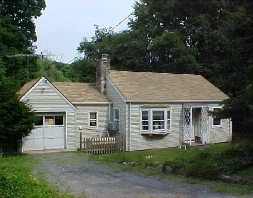 1431 High Ridge Road Stamford, CT 06903 - Photo 1 of 1 a front view of a house with a garden