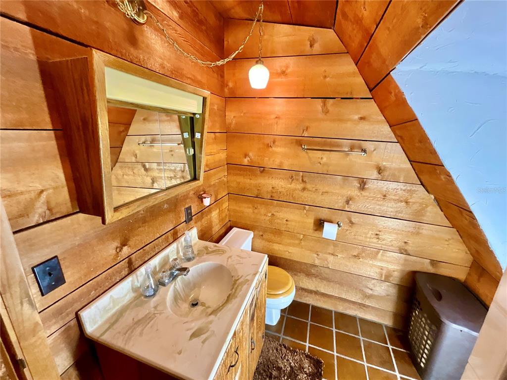 141 Tucker Lake Road Melrose, FL 32666 - Photo 17 of 29 a bathroom with a sink and a mirror