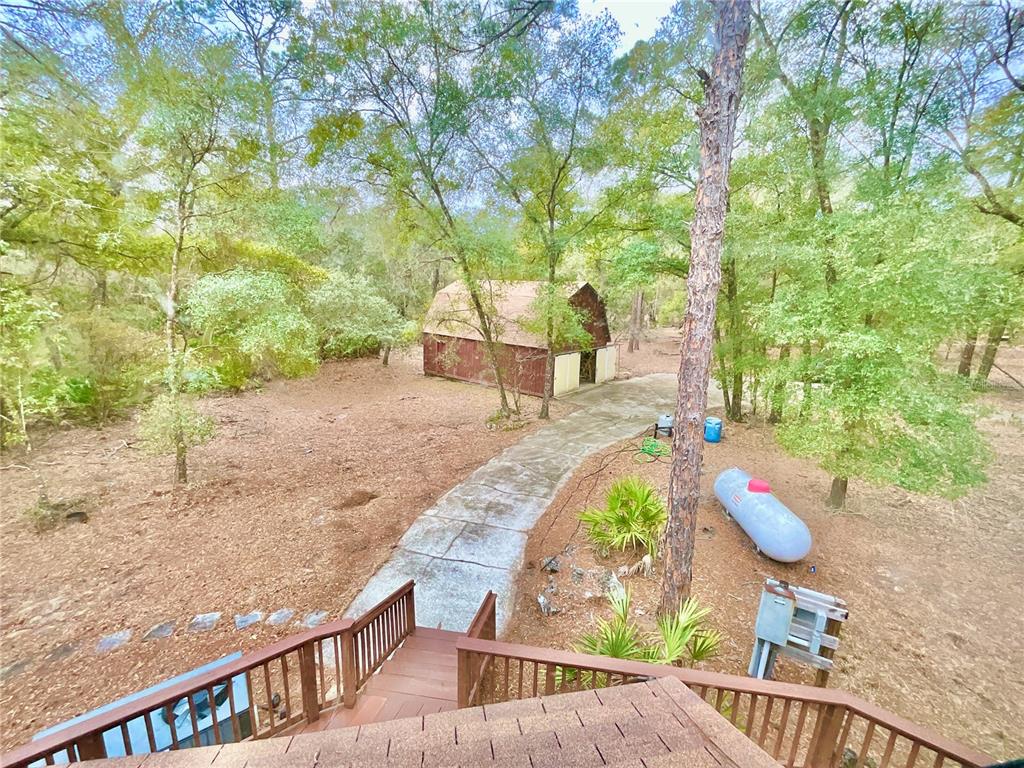 141 Tucker Lake Road Melrose, FL 32666 - Photo 18 of 29 a view of yard from deck with patio