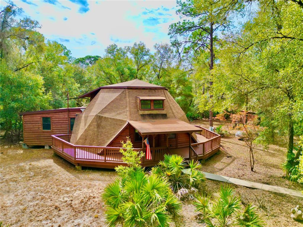 141 Tucker Lake Road Melrose, FL 32666 - Photo 24 of 29 an aerial view of a house with swimming pool garden view and trees