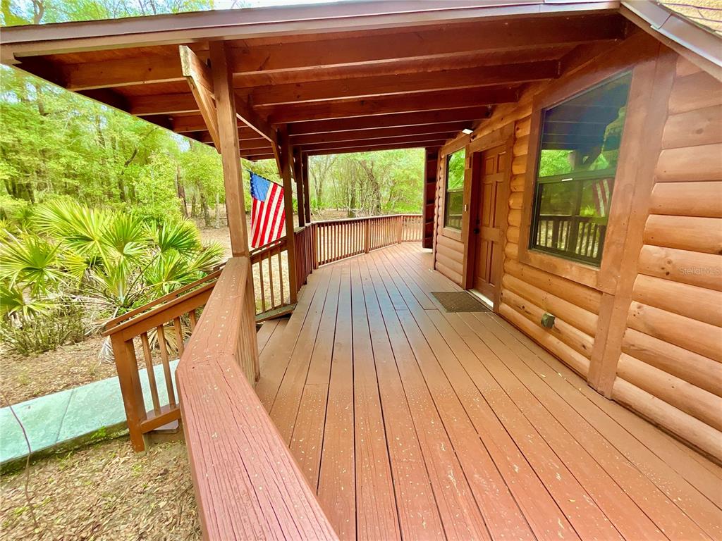 141 Tucker Lake Road Melrose, FL 32666 - Photo 26 of 29 a view of outdoor space with wooden floor and outdoor seating