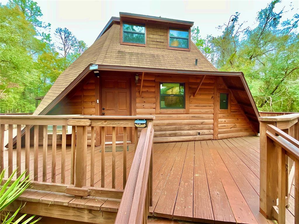 141 Tucker Lake Road Melrose, FL 32666 - Photo 27 of 29 a view of a house with wooden floor and fence