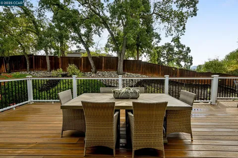 a view of a deck with furniture