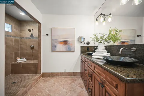 a kitchen with stainless steel appliances granite countertop a sink and a stove