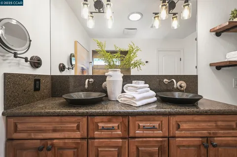 a kitchen with a table and chairs
