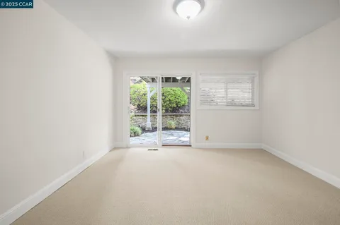a spacious bathroom with a granite countertop sink and a mirror