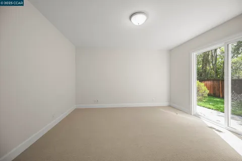 a view of a balcony with trees