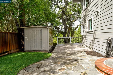 an aerial view of a house with a garden and yard