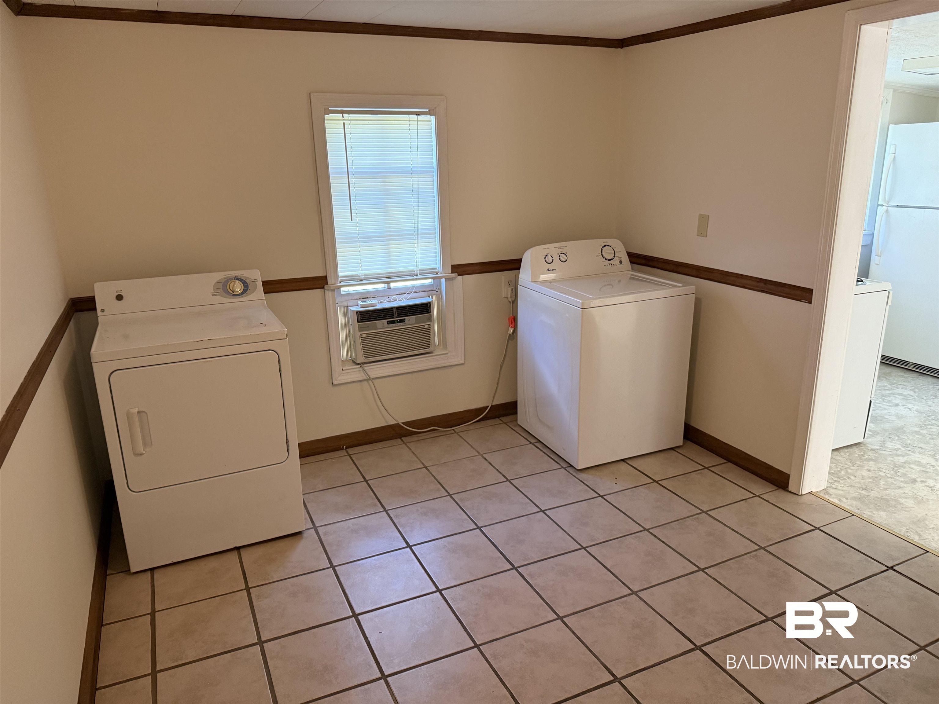 3630 Highway 29 Brewton, AL 36426 - Photo 10 of 13 Clothes washing area featuring cooling unit, light tile patterned floors, and ornamental molding