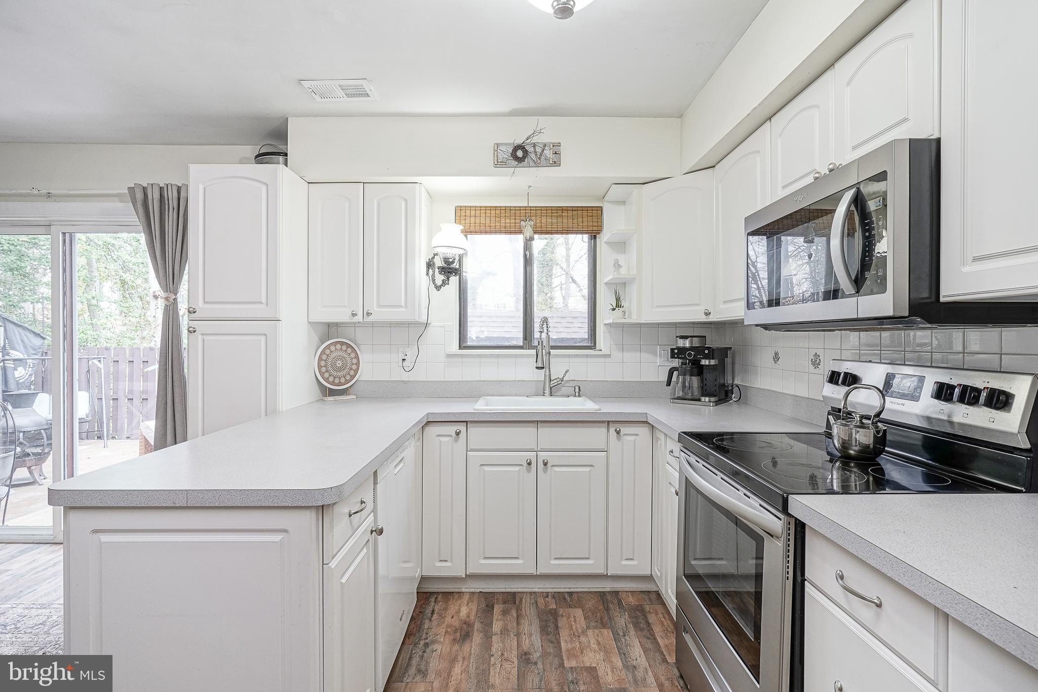 8 Sycamore Court Lumberton, NJ 08048 - Photo 11 of 26 a kitchen with a sink a stove a refrigerator and a window