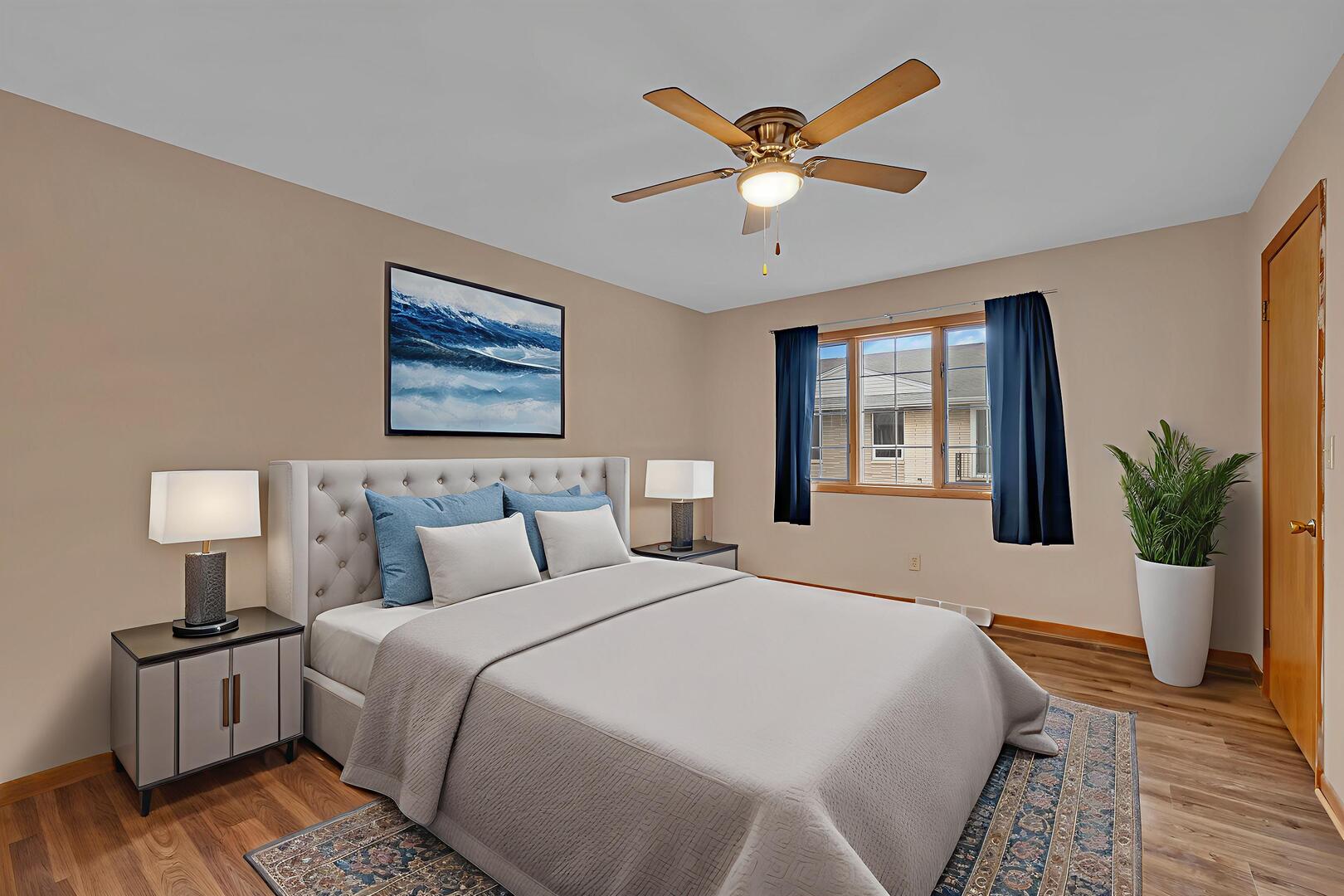 613 East 3rd Street, Unit 4 Lockport, IL 60441 - Photo 10 of 25 a bedroom with a large bed and a window