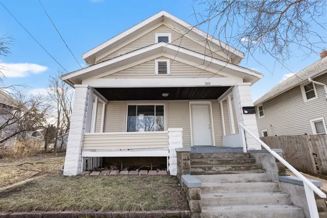 a front view of a house with large windows