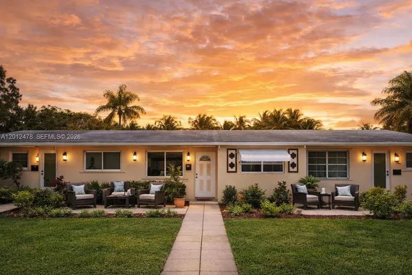 a front view of house with yard having outdoor seating