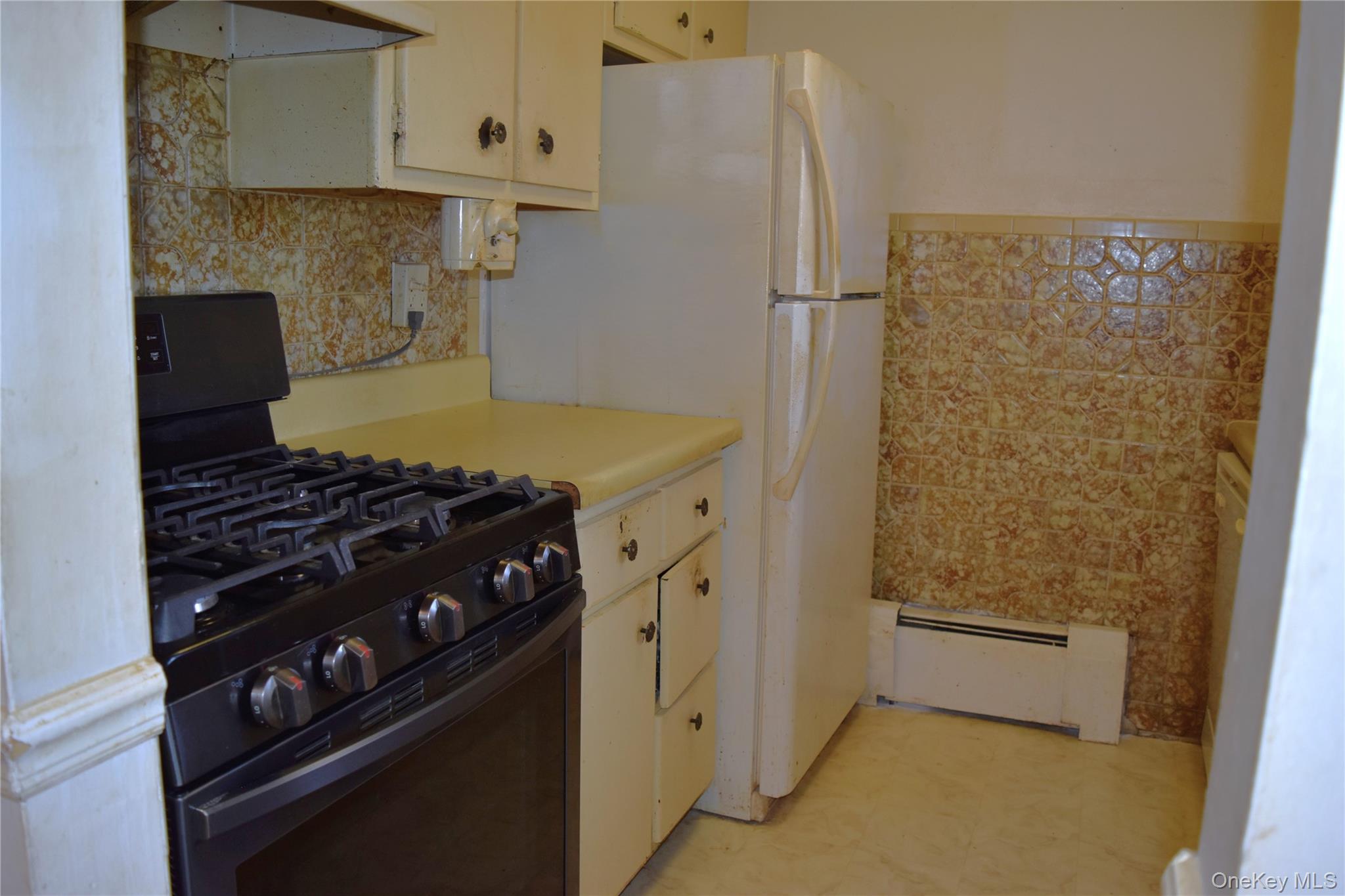 37 Tanager Road, Unit 3704 Monroe, NY 10950 - Photo 12 of 25 a kitchen with white cabinets and white appliances