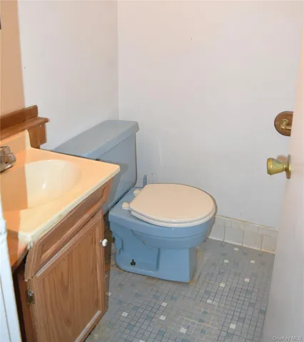 a bathroom with a toilet and a sink
