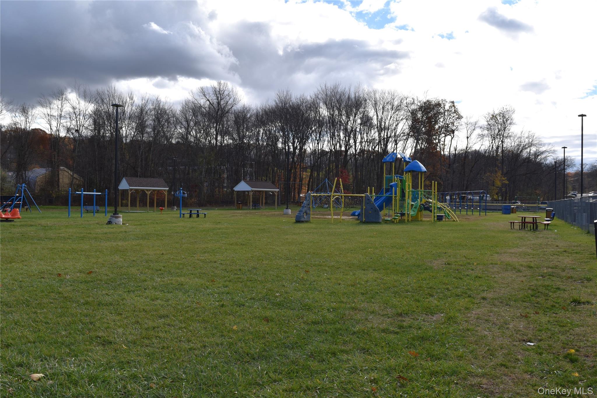 37 Tanager Road, Unit 3704 Monroe, NY 10950 - Photo 21 of 25 a view of a park with swings and slides
