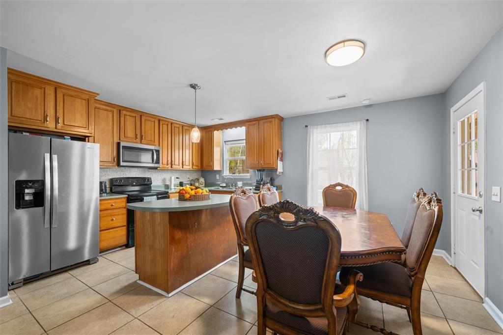 171 Bear Den Court Dalton, GA 30721 - Photo 16 of 30 a view of a dining room with furniture window and outside view
