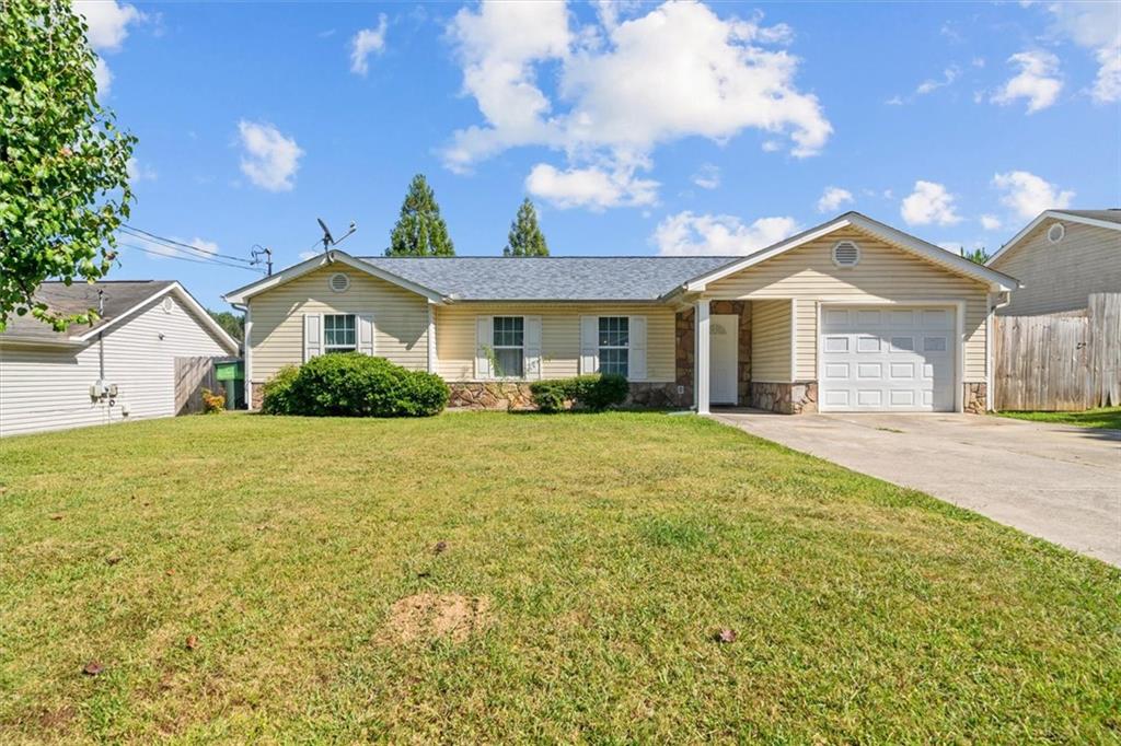 171 Bear Den Court Dalton, GA 30721 - Photo 2 of 30 a front view of a house with a garden