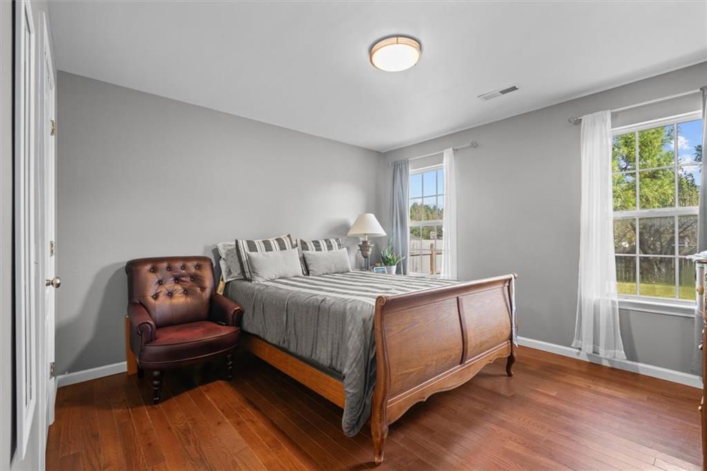 171 Bear Den Court Dalton, GA 30721 - Photo 22 of 30 a bedroom with a bed and window