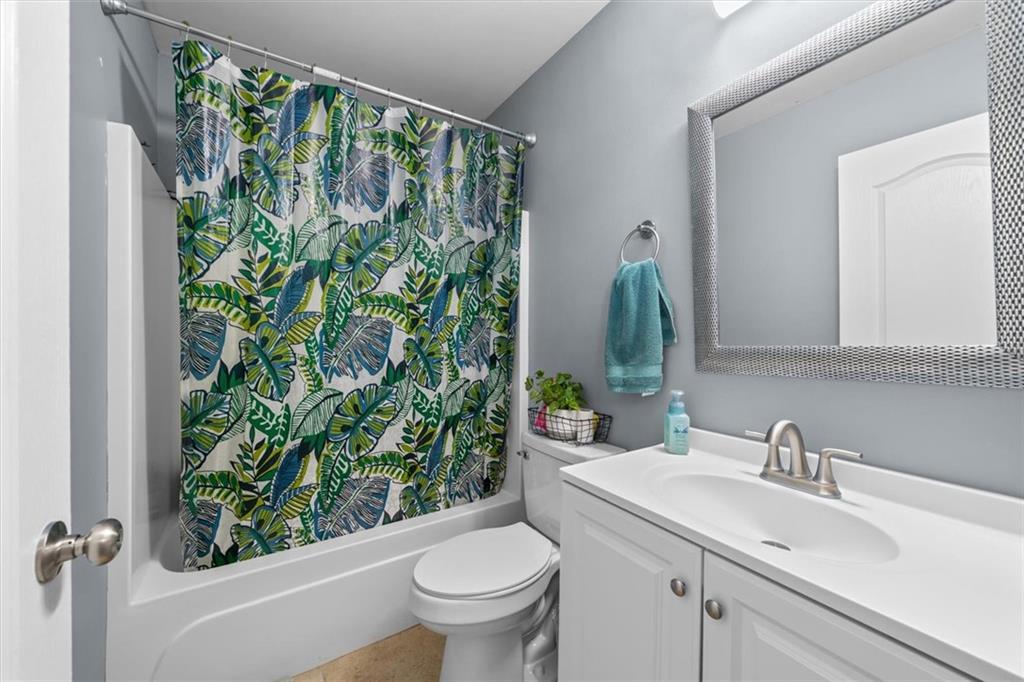 171 Bear Den Court Dalton, GA 30721 - Photo 24 of 30 a bathroom with a sink and mirror with toilet