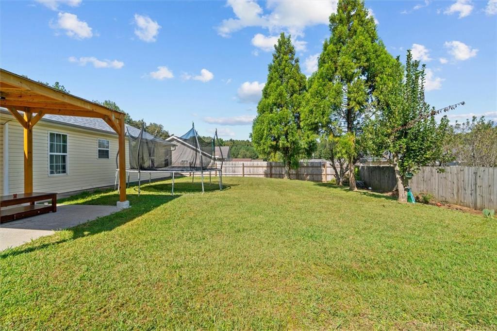 171 Bear Den Court Dalton, GA 30721 - Photo 29 of 30 a view of backyard of house with green space