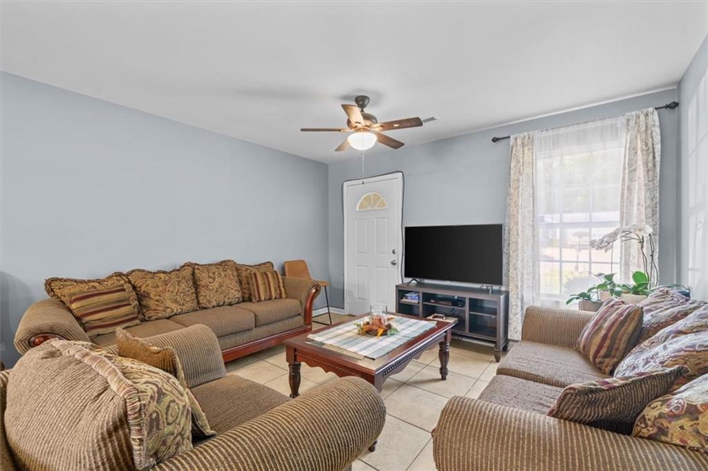 171 Bear Den Court Dalton, GA 30721 - Photo 8 of 30 a living room with furniture and a flat screen tv