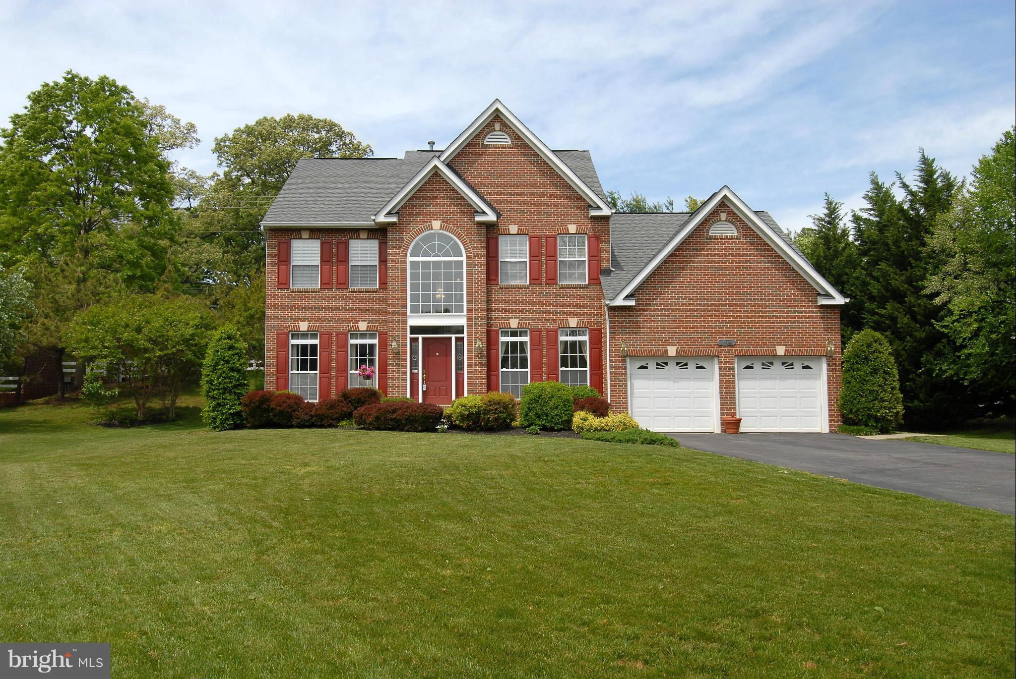 1200 Breckenridge Court Riva, MD 21140 - Photo 1 of 28 a front view of a house with a yard and garage