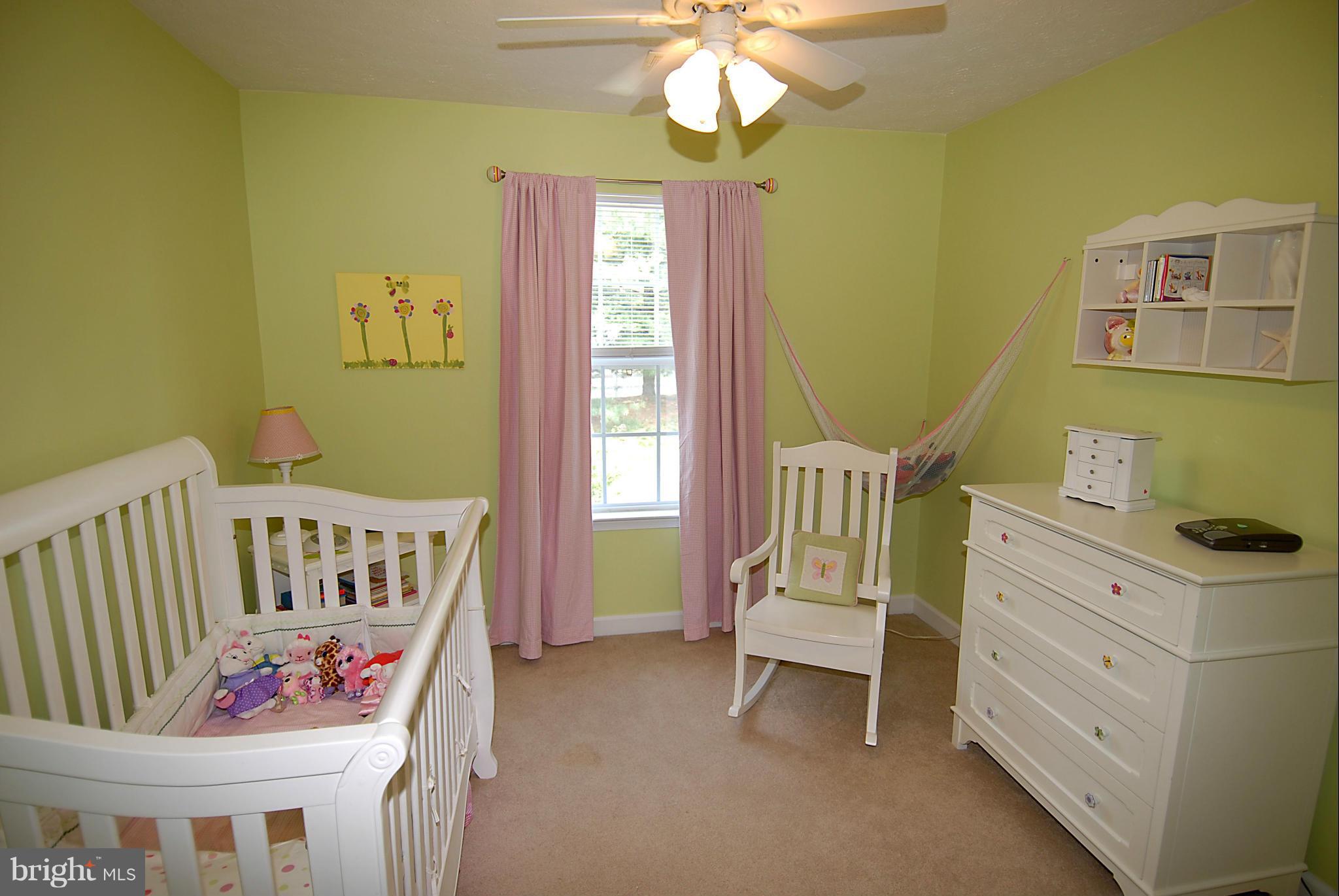 1200 Breckenridge Court Riva, MD 21140 - Photo 17 of 28 a bedroom with a window and a chandelier